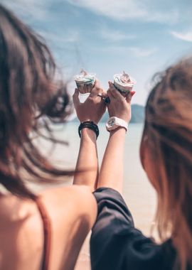 People holding cupcakes