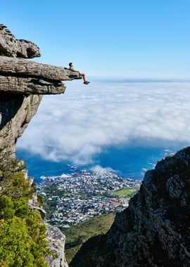 person sitting on mountain