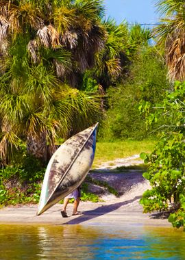 Man Carrying A Canoe