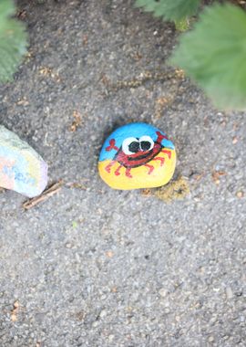 Kids drawing on stones