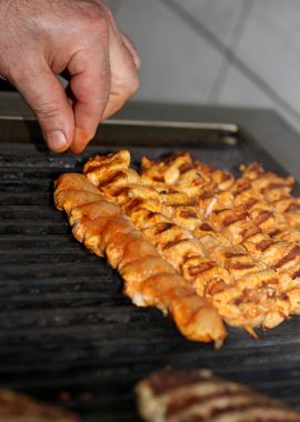 Meat baking on Greek grill