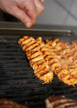 Meat baking on Greek grill