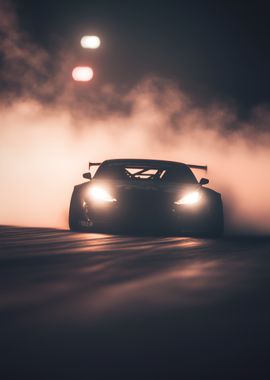 black racing car drifting out of a cloud of smoke