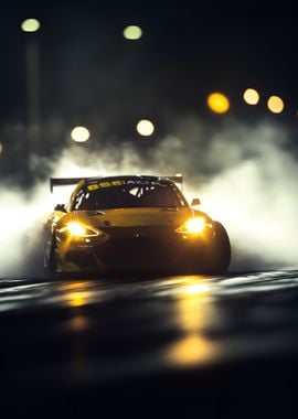 yellow racing car drifting out of a cloud of smoke