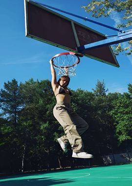 Woman Dunking Basketball