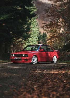 Red BMW E30 in Forest