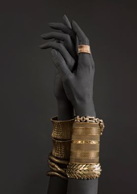 Gold Jewelry on Black Hands