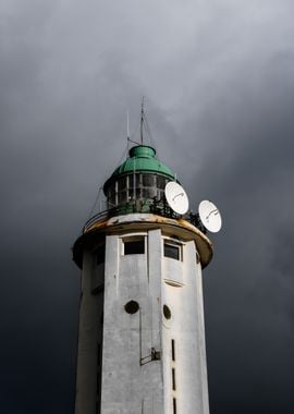 Lighthouse Under Storm Clouds