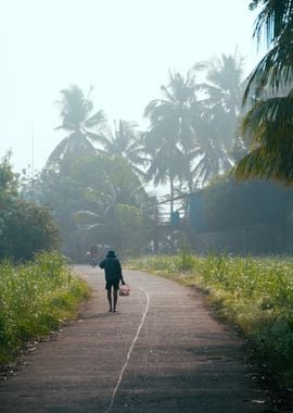 Man Walking on a Misty Road