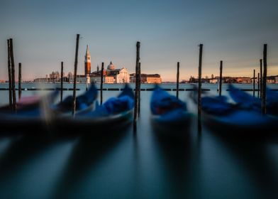 Waving gondolas in Venice, San Giorgio Maggiore in the  ... 