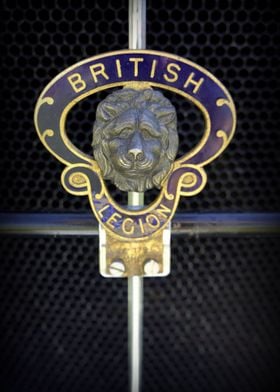 The hood ornament on an antique English car