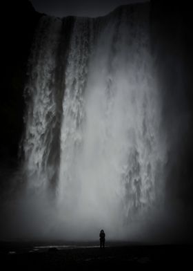 A solitary figure shows the scale of this waterfall in  ... 