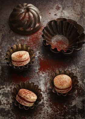 French macarons on rustic board in antique vintage baki ... 