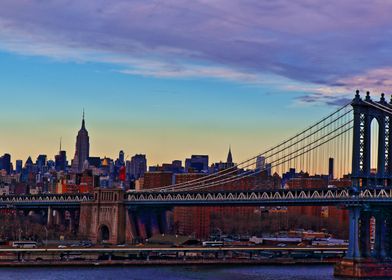 Manhattan Bridge with the Empire State Building in the  ... 