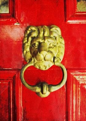 Golden Brass Lion On Red Door