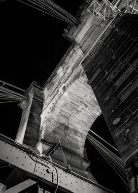 A dramatic night view of one of the arch piers of the h ... 