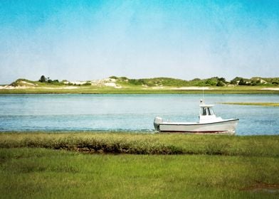 A fishing boat glides through the water as seen from th ... 