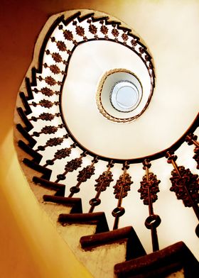 Spiral staircase in yellow and orange tones