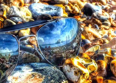 Sunglasses on pebbles