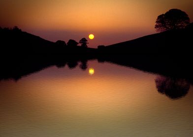 Sunset over Bruton Lake, Somerset. A secret lake, you w ... 