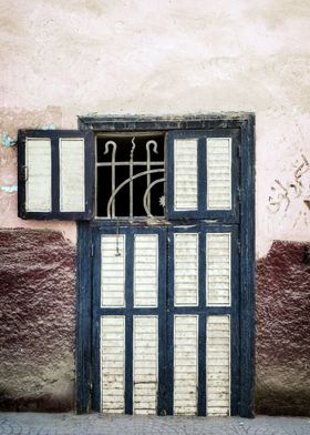 an Oriental door in Egypt with one window open