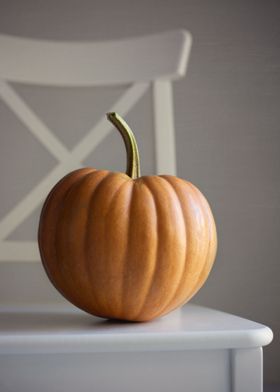 One pumpkin on the chair