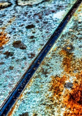 Rusty texture and colours on a scrap automobile