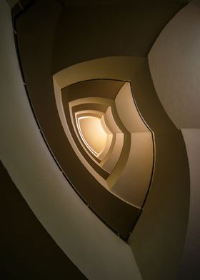 Spiral staircase in brown and golden tones