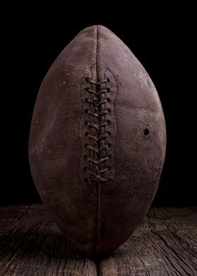 An old vintage leather football under dramatic lighting ... 