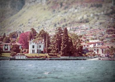 On Lake Como, a white Italian villa and a lakeside and  ... 