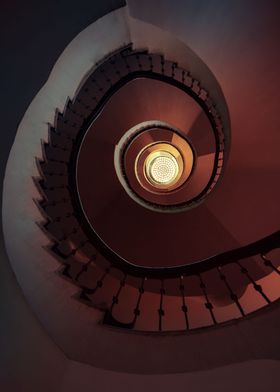 Spiral staircase in brown and red tones