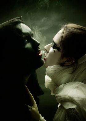 Couple sharing cigarette smoke