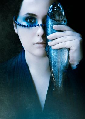 Surreal image of a girl holding fish