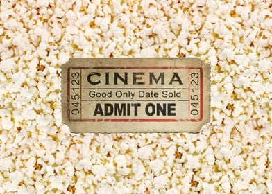 This is an old cinema ticket with a popcorn background. ... 