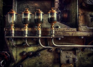Industrial detail of an old heavy iron machine with oil ... 