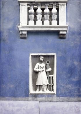 A carving below a balcony on a wall in Venice, Italy, f ... 