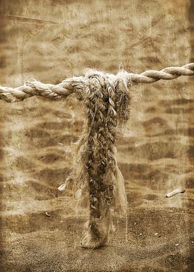 Old boat rope found on the beach. Vintage antique photo ... 