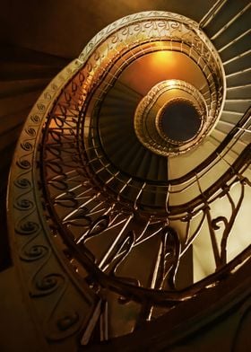 Spiral stairs in golden tones