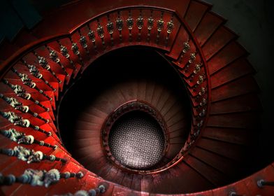 Spiral staircase in red tones