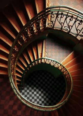 Spiral stairs in red, orange and brown tones