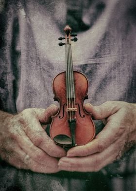 Luthier in Vienna holding a small violin
