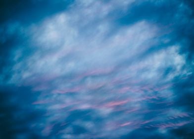 Photograph of a blue and red cloudy sky on sunset