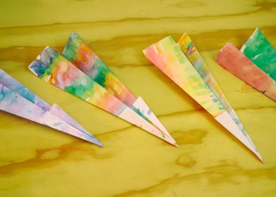 Photograph of some colorful origami paper planes