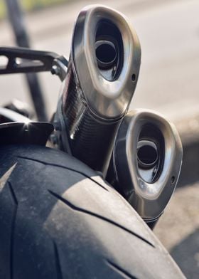 close up of a modern DUCATI exhaust and rear wheel