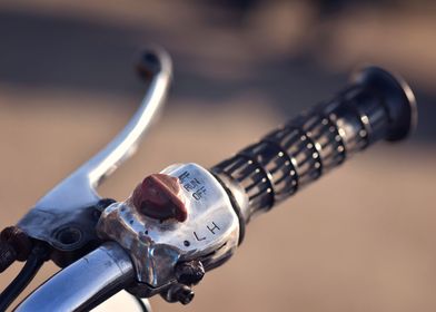 close up of a motorcycle handle and brake lever