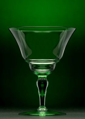 A beautiful wine glass surrounded by a green haze.