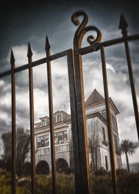 Detail of old iron gate to an abandoned haunted mansion ... 