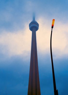 CN Tower in Toronto with orange streetlamp
