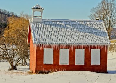 Little red schoolhouse on a winter day