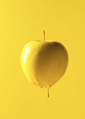 Golden apple, dripping and glossy.